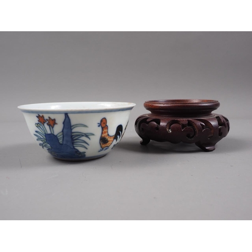 108 - A Chinese porcelain Ducai tea bowl, decorated chickens, six-character mark to base, 3 1/4