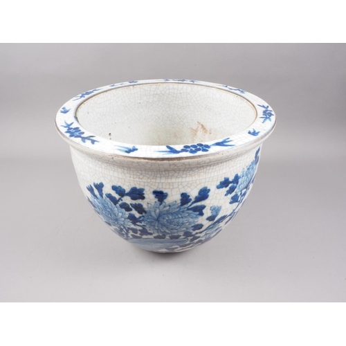 111 - A Chinese blue and white crackle ware jardiniere with bird decoration, 12 3/4