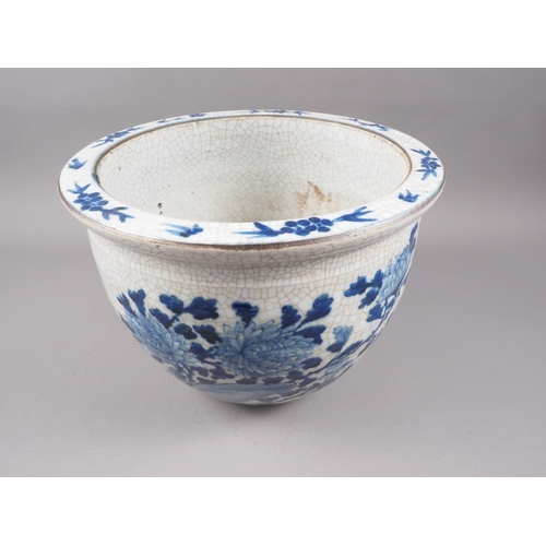 111 - A Chinese blue and white crackle ware jardiniere with bird decoration, 12 3/4