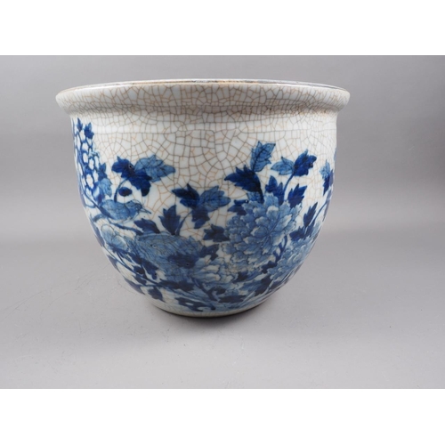 111 - A Chinese blue and white crackle ware jardiniere with bird decoration, 12 3/4