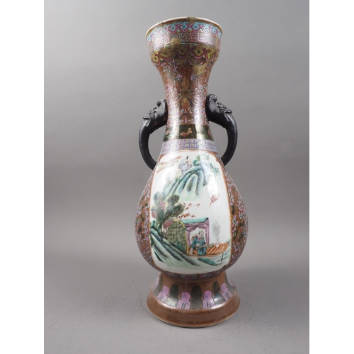 113 - A Chinese porcelain two-handled vase with flared rim and landscape panels, 15 1/2