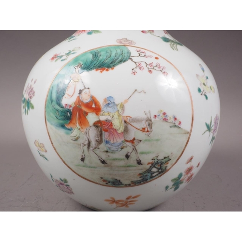 118 - A Chinese porcelain bulbous vase with enamelled panels of figures in landscapes on a floral strewn g... 