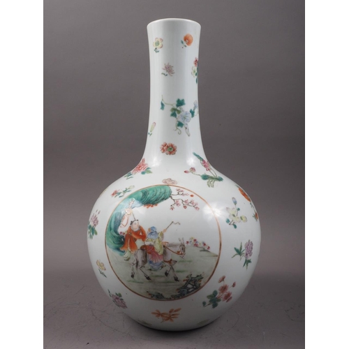 118 - A Chinese porcelain bulbous vase with enamelled panels of figures in landscapes on a floral strewn g... 