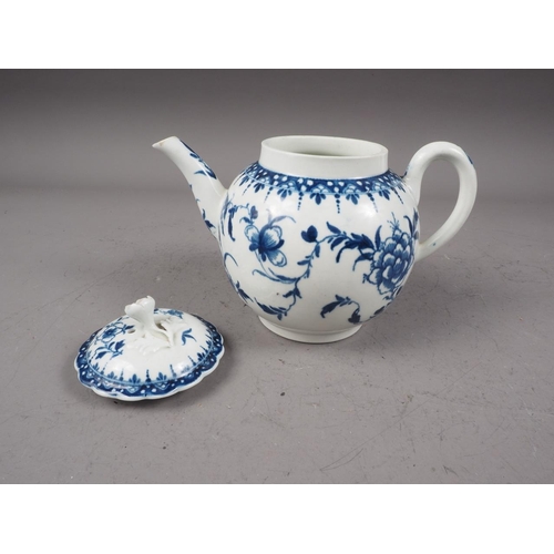 14 - A mid 18th century Worcester blue and white globular teapot and cover with hand-painted floral spray... 