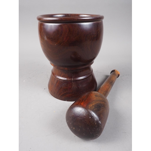 168 - An antique turned lignum vitae pestle and mortar, mortar 6 3/4