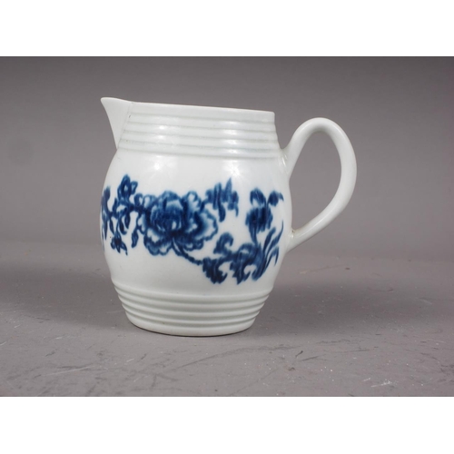 17 - A mid 18th century Worcester blue and white barrel-shaped cream jug with floral decoration, 2 3/4