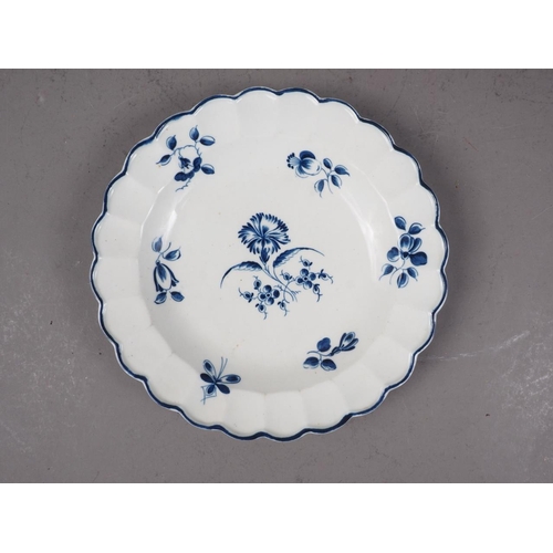 19 - A mid 18th century Worcester blue and white lobed edge plate with floral centre, 8