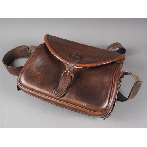 192 - A DGL brown leather cartridge bag, 12 3/4