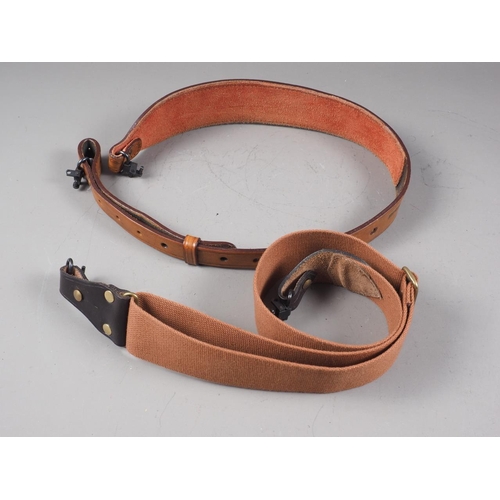 193 - A Theohen tan leather gun strap, 34