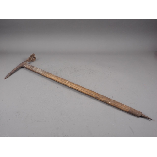 242 - An early 20th century ice axe, 33 3/4