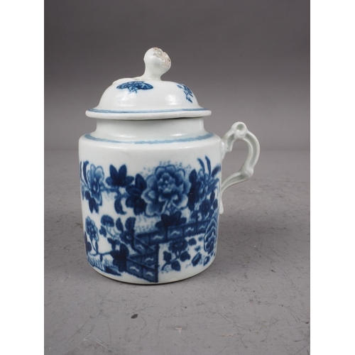 26 - A mid 18th century Worcester blue and white wet mustard pot with moulded scroll handle and fence pat... 