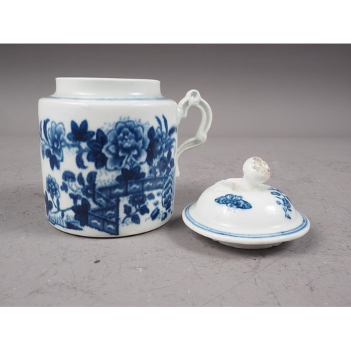 26 - A mid 18th century Worcester blue and white wet mustard pot with moulded scroll handle and fence pat... 