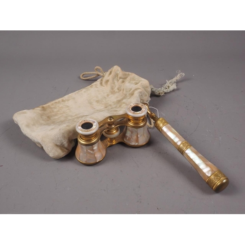 266 - A pair of brass and mother-of-pearl adjustable opera glasses, an Egyptian style plaque, 2 3/4