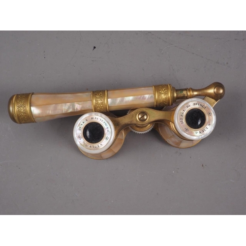 266 - A pair of brass and mother-of-pearl adjustable opera glasses, an Egyptian style plaque, 2 3/4