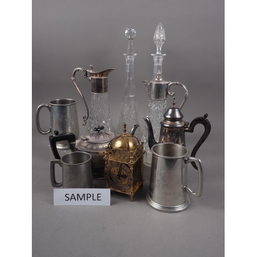 310 - Two silver plated collared claret jugs, a plated teapot, a Picquot ware coffee pot, three decanters,... 