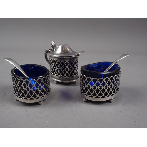 315 - A pair of silver lattice salts with blue glass liners and a matching mustard pot, 1.25oz troy approx