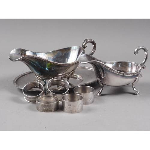 320 - Two silver napkin rings, 0.7oz troy approx, three silver plated napkin rings, two plated sauce boats... 