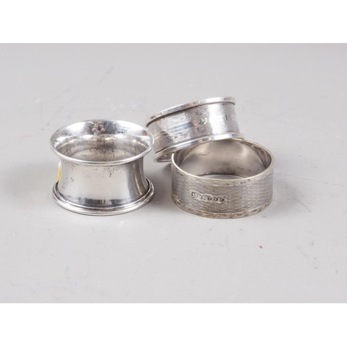 320 - Two silver napkin rings, 0.7oz troy approx, three silver plated napkin rings, two plated sauce boats... 