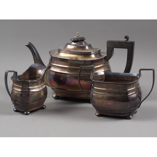 327 - A silver melon teapot with ebonised knop and handle, and a matching milk jug and sugar bowl, 35.8oz ... 