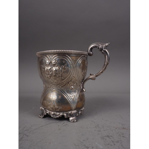 329 - A Victorian silver christening mug with embossed decoration, 4.2oz troy approx