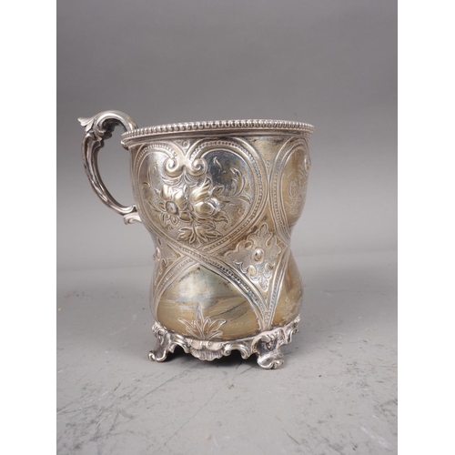 329 - A Victorian silver christening mug with embossed decoration, 4.2oz troy approx