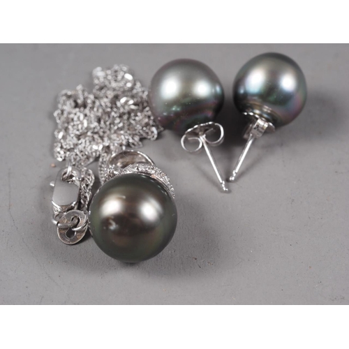 333 - A South Sea black pearl diamond and 18ct white gold pendant, on an 18ct gold fine link necklace, and... 