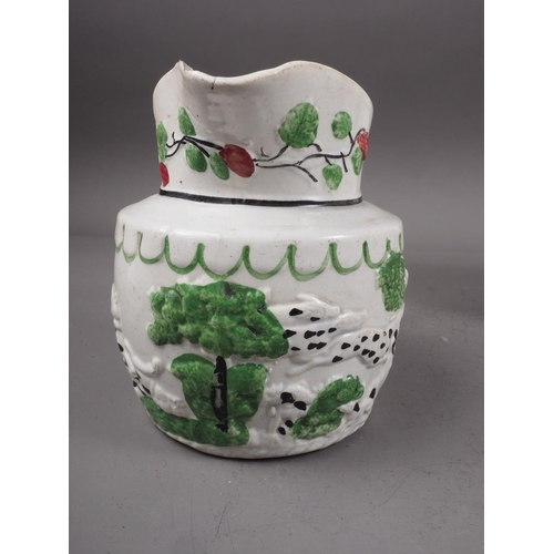 34 - A 19th century Pratt type relief decorated jug, 