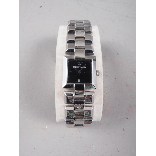 348 - A lady's Emporio Armani wristwatch with square face, in original case with documentation