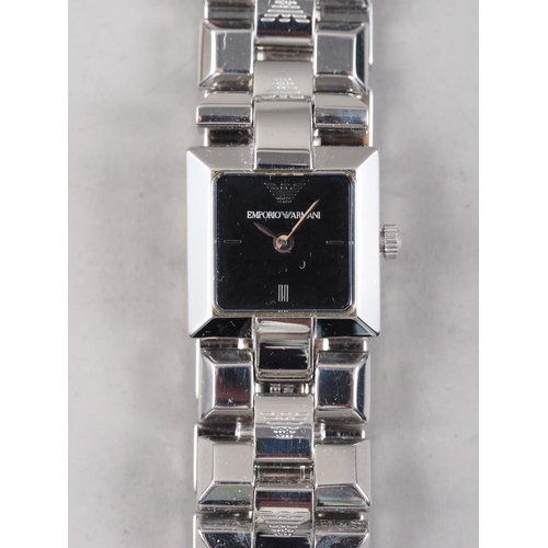 348 - A lady's Emporio Armani wristwatch with square face, in original case with documentation