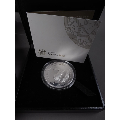 362 - A 2017 UK six coin proof set, a 2019 silver proof 50p silver proof 50p six coin set, a silver Kruger... 