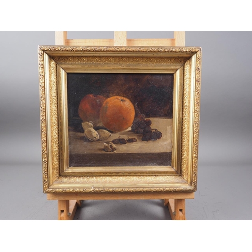 470 - An oil on canvas, still life with orange, apple and dried fruits, 7 3/4