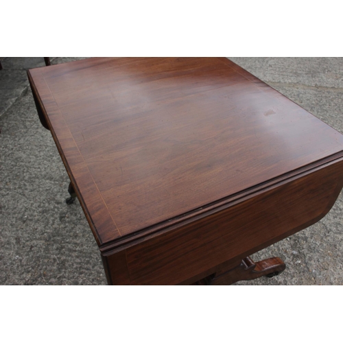 476 - An early 19th century mahogany and banded sofa table, fitted two drawers with brass ring handles, on... 