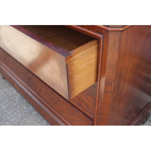 483 - A 19th century French plum pudding marble top commode, fitted five drawers, on block base, 48