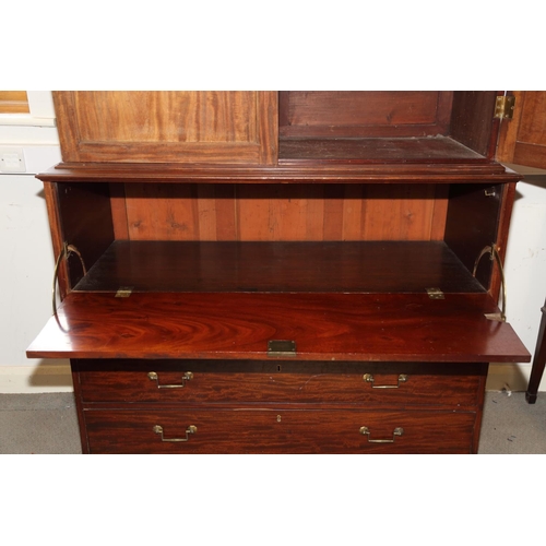 487 - A 19th century mahogany secretaire bookcase, the upper section enclosed two doors over non-fitted wr... 