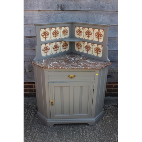 489 - A late 19th century grey painted marble top and tile back corner washstand, 38