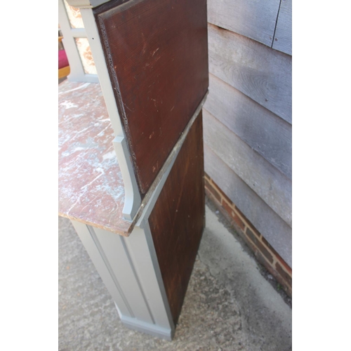 489 - A late 19th century grey painted marble top and tile back corner washstand, 38