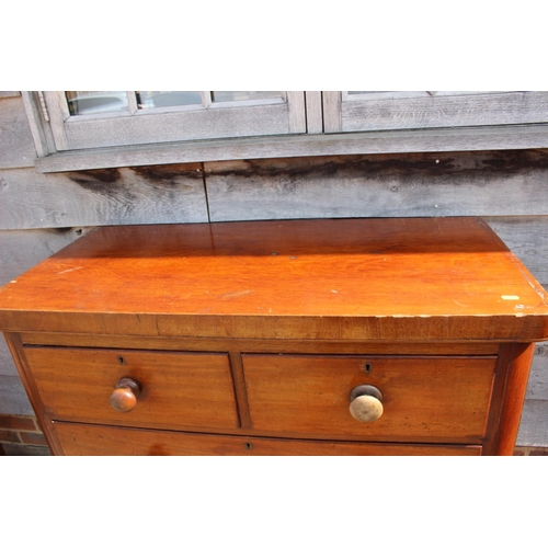 490 - A Victorian mahogany chest of two short and three long drawers with knob handles, on block base, 39