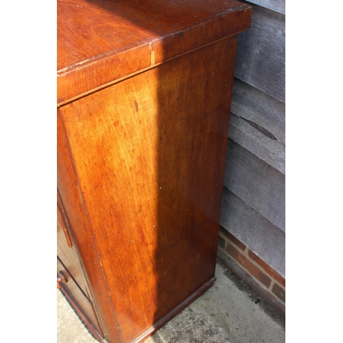 490 - A Victorian mahogany chest of two short and three long drawers with knob handles, on block base, 39