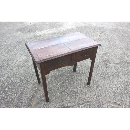 509 - An 18th century walnut side table, fitted two drawers, on chamfered supports, 32