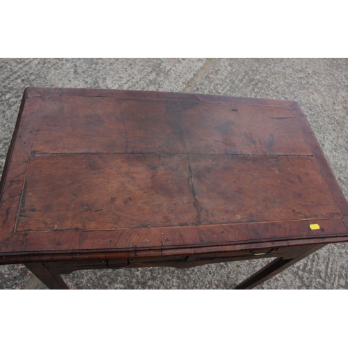 509 - An 18th century walnut side table, fitted two drawers, on chamfered supports, 32