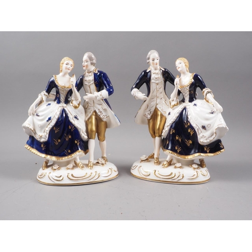 52 - A pair of Japanese porcelain groups, figures in period costume with gilt decoration, 8