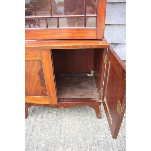 520 - A pair of George III figured mahogany display cabinets enclosed Gothic lattice glazed panel doors ov... 