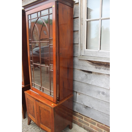 520 - A pair of George III figured mahogany display cabinets enclosed Gothic lattice glazed panel doors ov... 