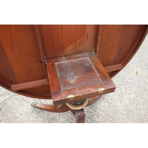 521 - A Regency/William IV rosewood and banded brass inlaid circular top table, on turned column and tripo... 