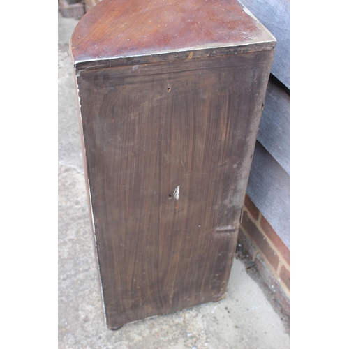 523 - A 19th century mahogany and gilt brass mounted bowfront corner cupboard enclosed two doors, 19