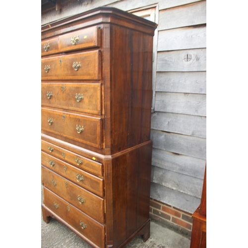 526 - An early 18th century figured walnut and feather banded chest on chest, the upper section fitted two... 