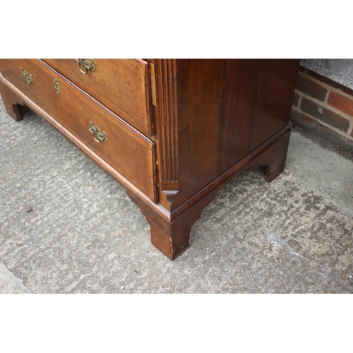 526 - An early 18th century figured walnut and feather banded chest on chest, the upper section fitted two... 