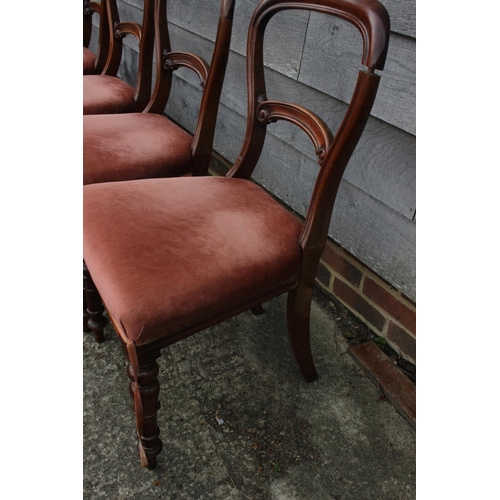 576 - A set of four hoop back dining chairs with stuffed over seats, upholstered in a salmon pink velour, ... 