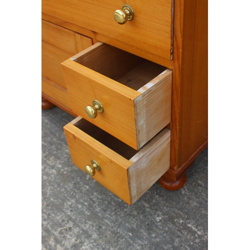 613 - An 18th century Oregon pine chest, fitted four graduated drawers over two small drawers and cupboard... 