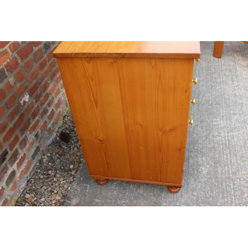 613 - An 18th century Oregon pine chest, fitted four graduated drawers over two small drawers and cupboard... 